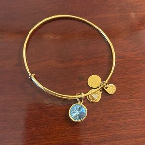 Alex and Ani Blue Topaz Elegant Gold Bangle with Blue Charm